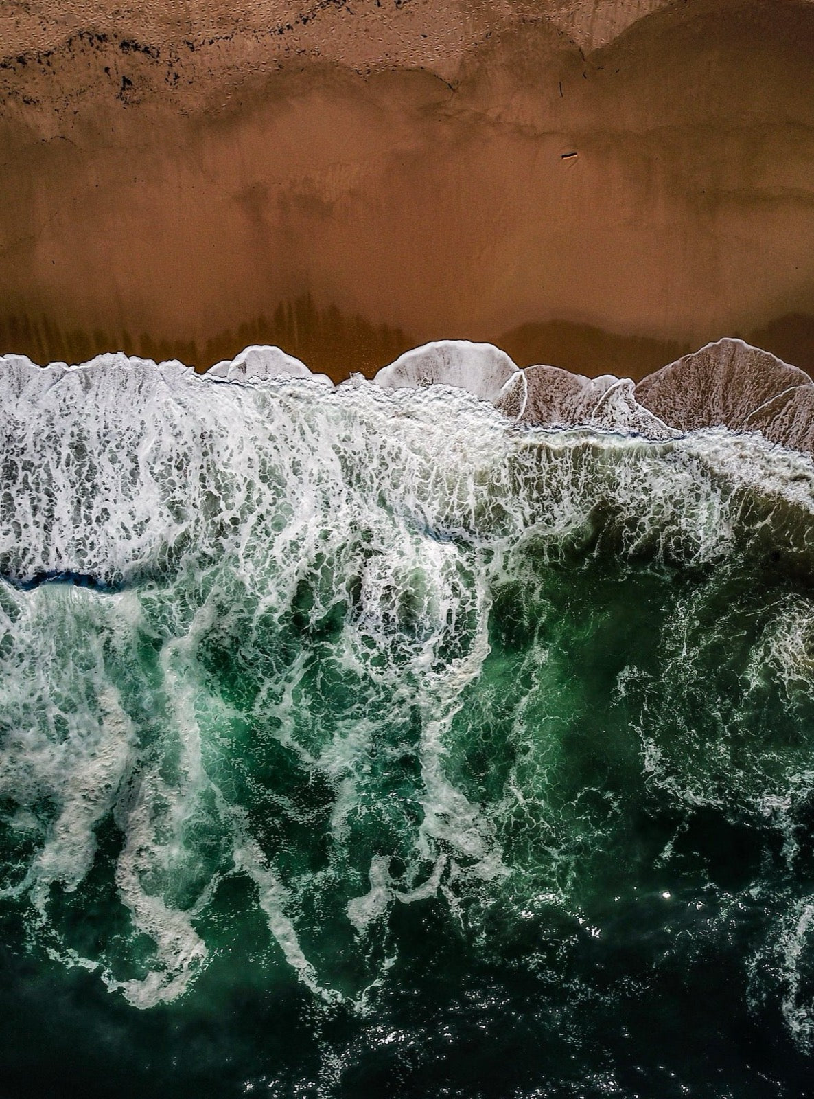 Waves breaking on the shore (placeholder photo)